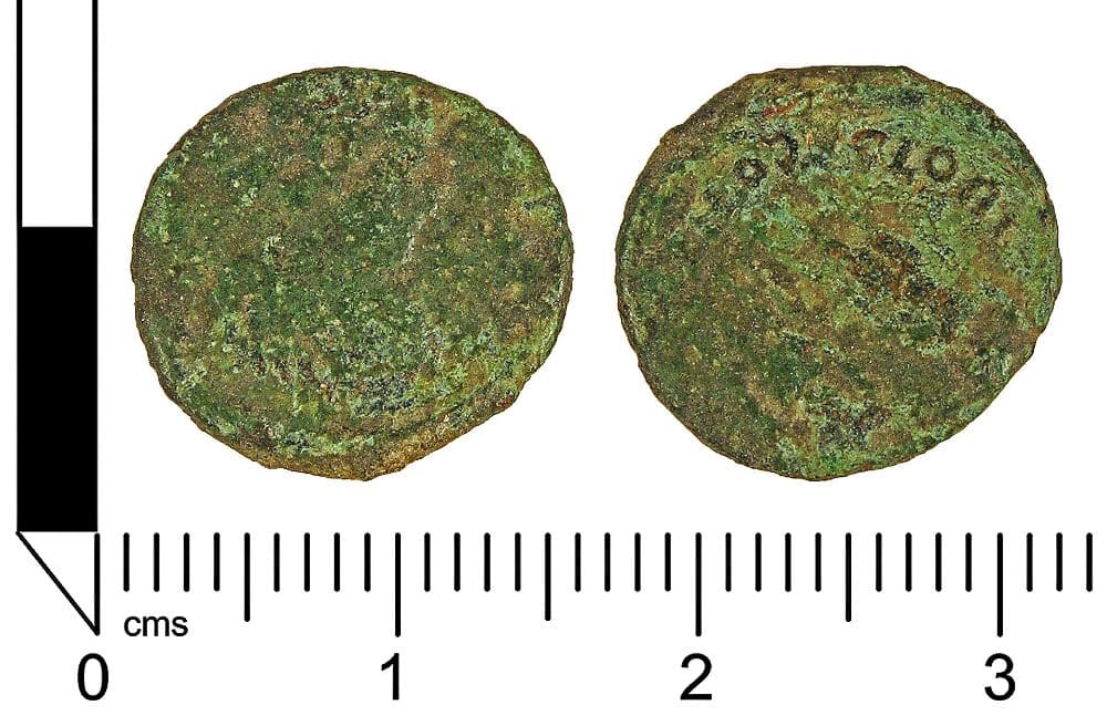 Obverse and reverse of a corroded copper-alloy nummus of the emperor Honorius found in Britain