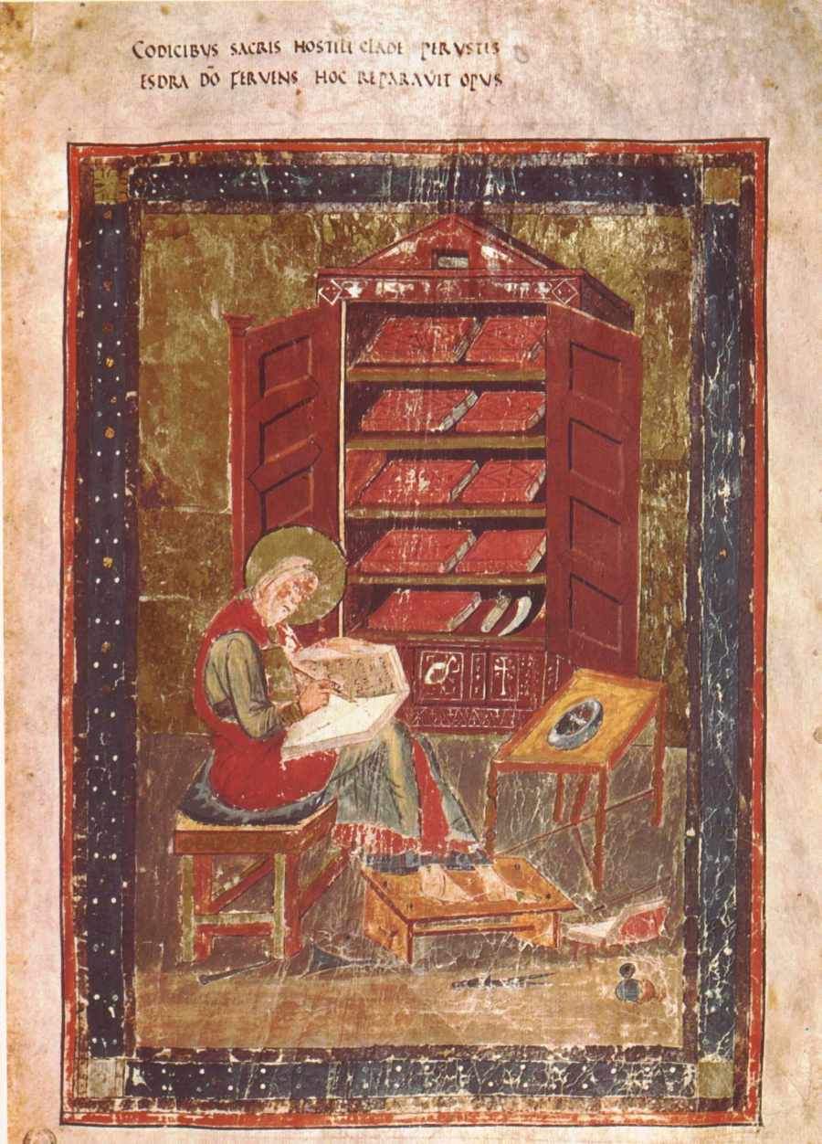Eighth-century manuscript illumination of the scribe Ezra writing at a desk before an open book cupboard