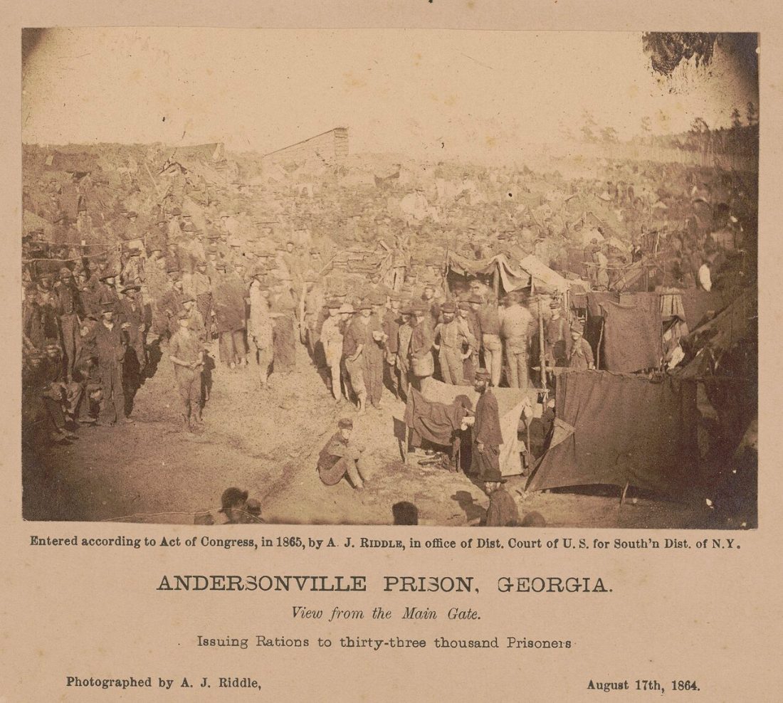 Crowds of prisoners packed shoulder to shoulder inside the stockade in 1864, photographed from the main gate during a ration issue