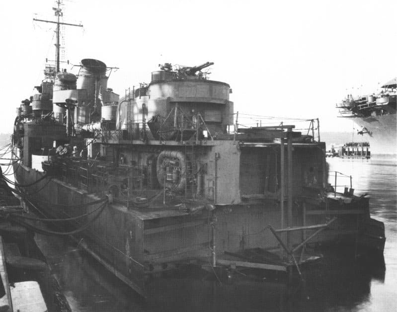 The destroyer USS Abner Read in a shipyard with her entire stern section missing behind the after gun mount