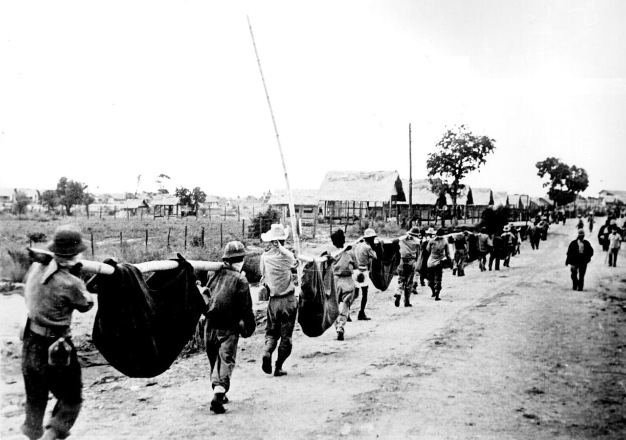 American prisoners of war carrying comrades on improvised litters